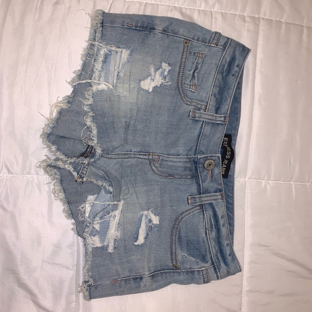 Light blue jean shorts. Ripped